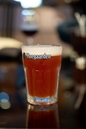 Udon Thani, Thailand - January 3, 2021 : Close up glass of Hoegaarden on table at night partyのeditorial素材