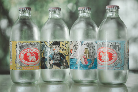 Samut Prakan, Thailand - January 12, 2021 : Bottle of Singha Corporation brand soda is a fizzy beverage made from compressed water with carbon dioxide gas on a nature backgroundのeditorial素材
