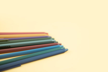 Gel pens of colorful of color on a yellow background. The concept of school stationery.の写真素材