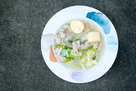 Clear soup with cabbage, tofu and minced pork, Thai cuisine. Healthy food concept