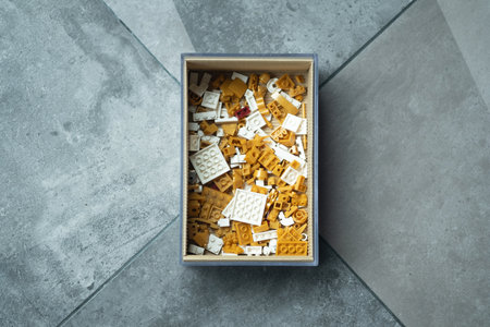 White and gold of plastic block toys in box. The concept of education, development and entertainment.の写真素材