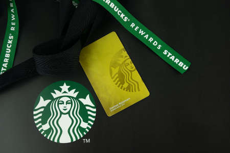 Samut Prakan, Thailand - February 2, 2021 : A gift exclusive for member gold level and Starbucks Rewards gold card from Starbucks coffee shop in 2021 yearのeditorial素材