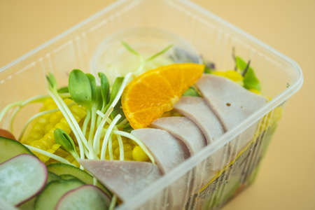 Fresh salad in plastic package for take away or food deliveryの写真素材