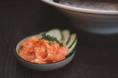 Thai style spicy salmon in white bowlの写真素材