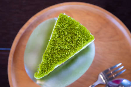 Pandan layer cake on wood dish. Top viewの写真素材