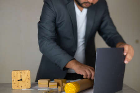Engineer working of real estate project on office desk at workplace. Construction & building conceptの写真素材