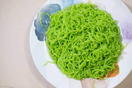 Green Jade noodles in dish in Thai called Mee Yok. Green handmade noodlesの写真素材