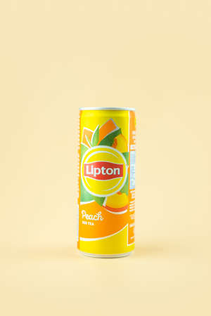 Bangkok, Thailand - February 20, 2021 : Aluminium can of Lipton Ice Tea product with peach flavour on a yellow backgroundのeditorial素材