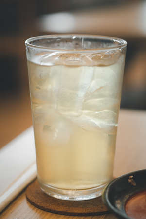 Close up of glass of iced japanese green tea in resturant.の写真素材