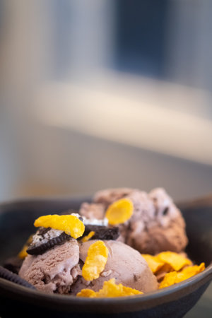 Chocolate Sundaes topping with corn flake and chocolate biscuits. Selective focus