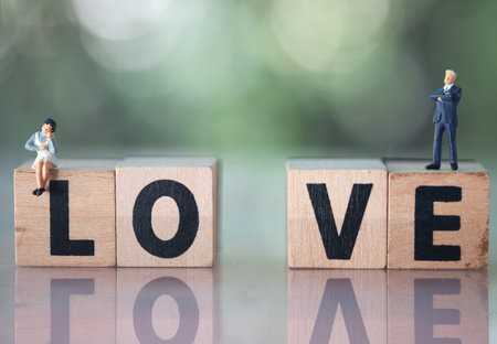 Miniature people : Couple of love with LOVE text. Concept for use in love relationship, divorce or...
