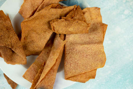 Sliced sheets of dried and crispy pork. Thai style appetizer.の写真素材