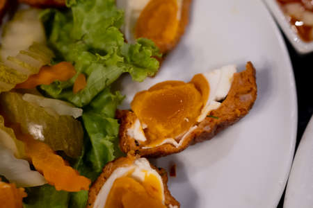 Thai Food - Deep Fried Salted egg wrap with fish Cakesの写真素材