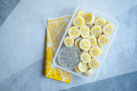 Delicious boiled banana served with black sesame mix sugar in box. Healthy snacks free of oil and fat, without seasonings and added ingredients.の写真素材