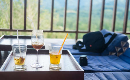Many of empty summer drink on the table after finished drink with nature backgroundの写真素材