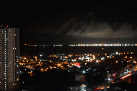 Defocused image of illuminated city at night. Bokeh of colorful night.の写真素材