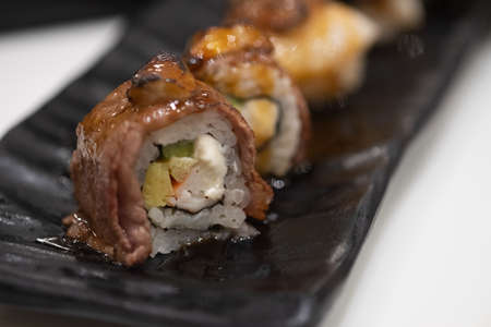 Beef maki sushi on top with foie gras. Selective focusの写真素材