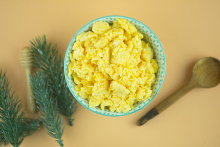 Scrambled eggs in small bowl. Top viewの写真素材