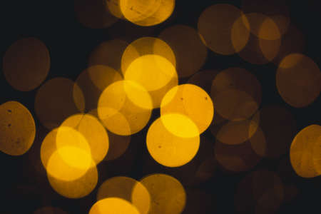 Abstract texture lights yellow bokeh background. Defocused Bokeh twinkling lights