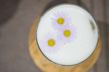 Close up of glass cocktail decoration with flower. Top viewの写真素材
