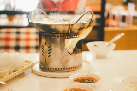 Thai hot pot recipe Thai called Jim-Jum. Thai traditional spicy shabu shabu, dipping meat in boiled spicy soup.の写真素材