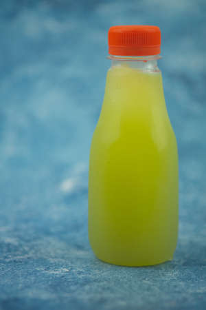 Cane juice in plastic bottle. organic drink extracted from sugar cane milling.の写真素材