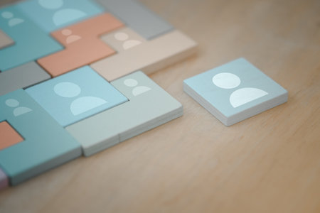 Tangram puzzle blocks with people icons. Human resources and management concept