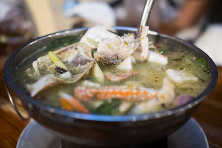 Tom Yum. Spicy soup with shrimp in a hot pot, Thai cuisineの写真素材