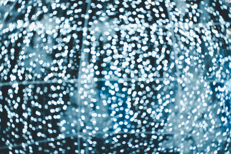 White pretty bokeh on dark background.の写真素材