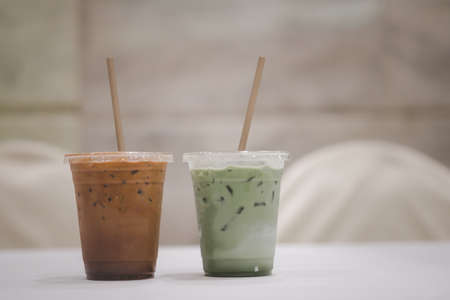 Iced matcha latte and iced mocha on table at meeting room