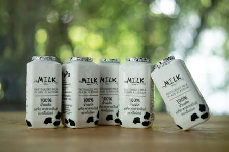 Samut Prakan, Thailand - May 5, 2021 : Pproduct Mmilk, pasteurized milk plain flavour place on wood tableのeditorial素材
