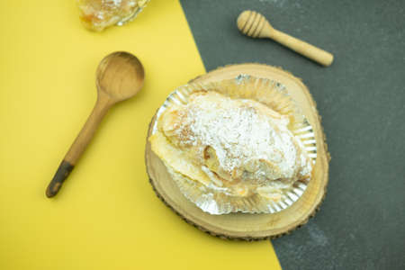Close up delicious sweet almond croissant in foil cup