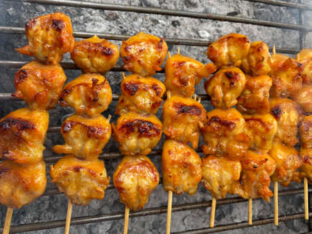 Chicken ass in skewered on the stove. Street foods in Thailand