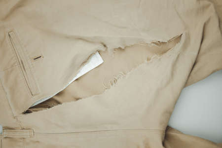 Man cloth from torn clothes with a hole. Top viewの写真素材