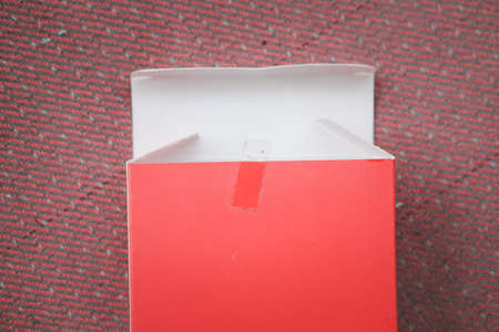 Open red paper box with white colour inside. Top viewの写真素材