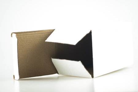 Opened cardboard box on a white background.