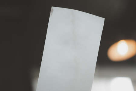 Person's hand holding empty paper bill. Selective focusの写真素材