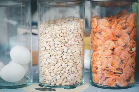 Papaya salad ingredients in a glass jar is a popular food for many people.の写真素材