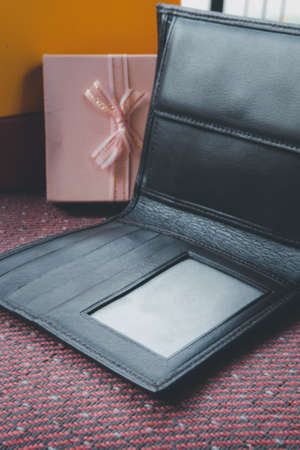 Genuine Brown Leather men's bifold wallet. Selective focusの写真素材