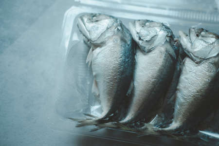 Pack of steamed mackerel in box. Top viewの写真素材