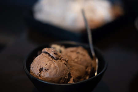 Delicious chocolate ice cream in bowl. Selective focus