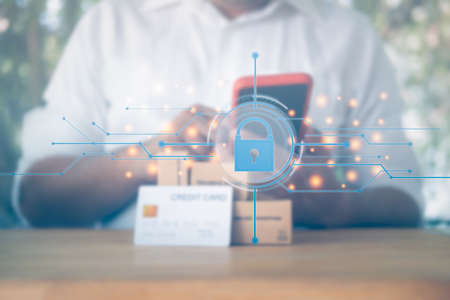 Man use mobile phone for online shopping and payment with security icons. Internet payments and...
