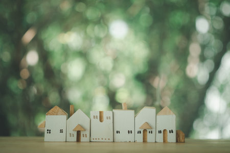 A lot of simply minimal design with miniature white toy house. The concept of a dream home and of community lives.の写真素材