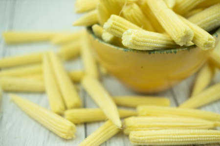 Close-up of heap of fresh young baby cornの写真素材