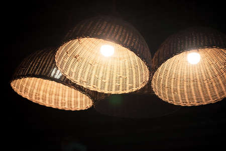Wicker lamps on the ceiling. Thai traditional handicrafts made from bamboo are beautiful and used as home decor.の写真素材