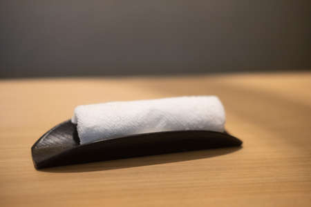 Rolling up white towel for hand wiping in Japanese restaurantの写真素材