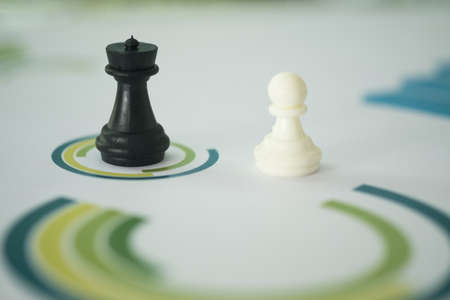 Chess placed over the business chart. Economy trends for business marketing strategy analysis.の写真素材