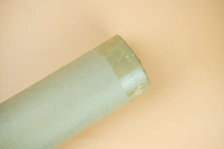 Packaging cardboard tubes and brown packaging tape roll like lid. Top view
