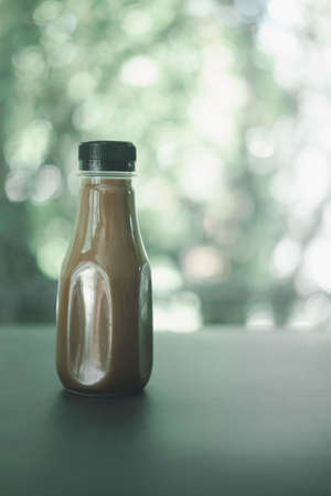 Tasty Mocha in plastic bottle during work from homeの写真素材