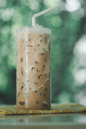 Iced mocha with milk against nature background.の写真素材